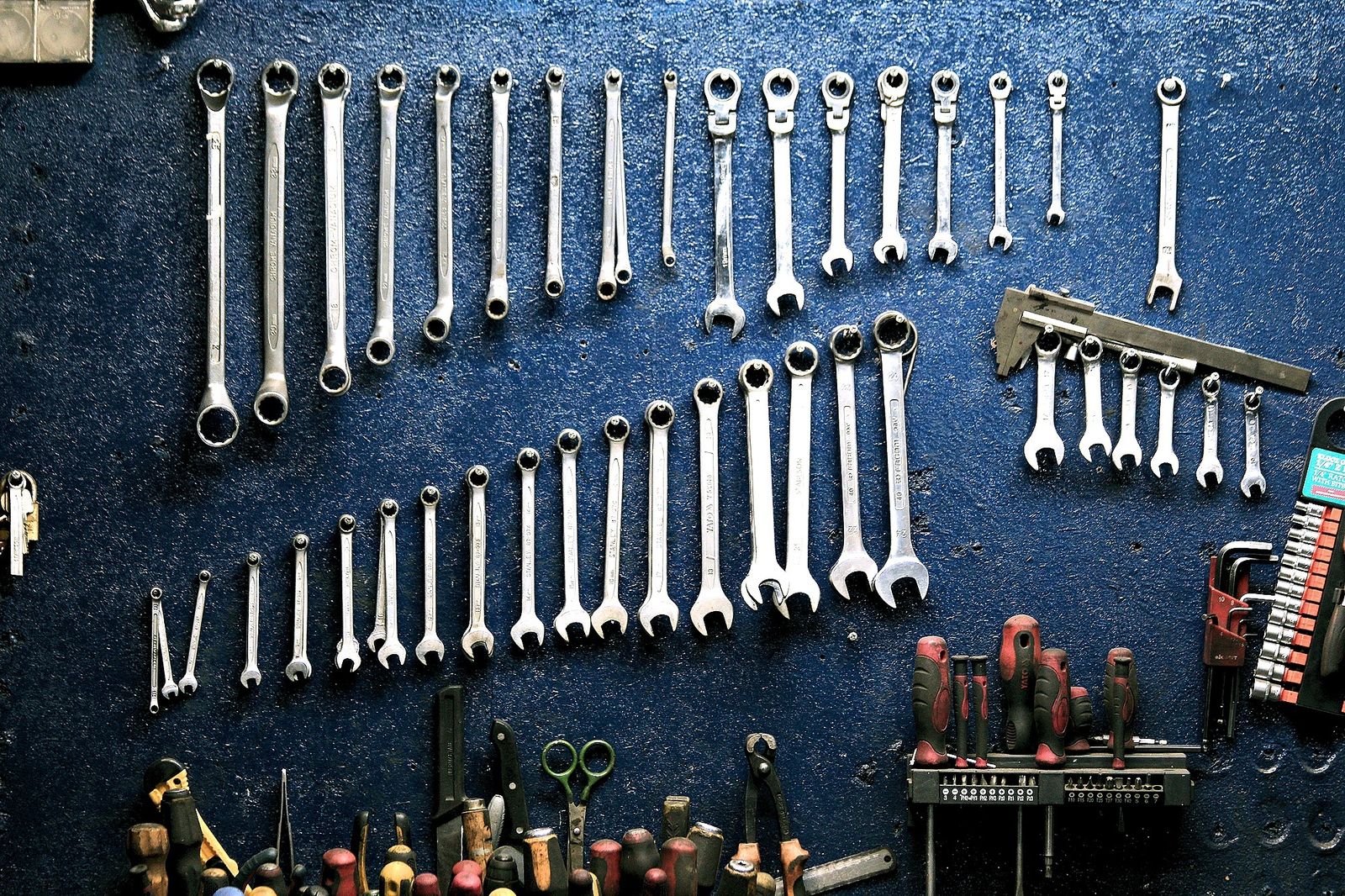 Workshop tools organized on wall display