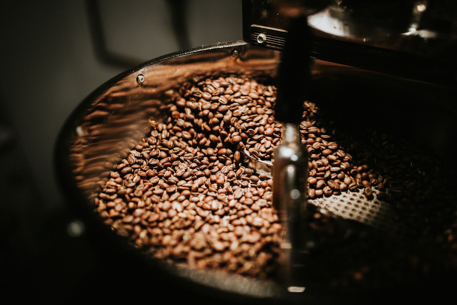 Coffee beans roasting in drum roaster