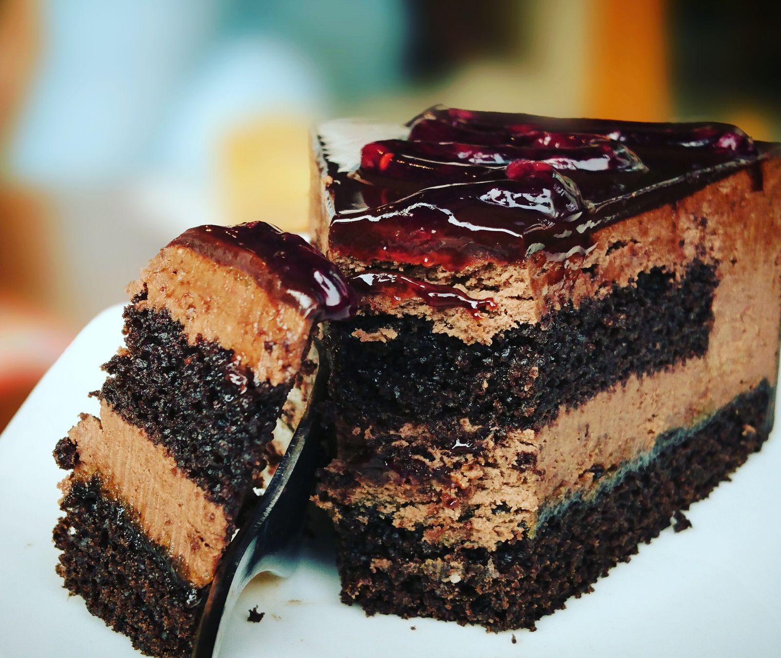 Classical chocolate layer cake with berry glaze
